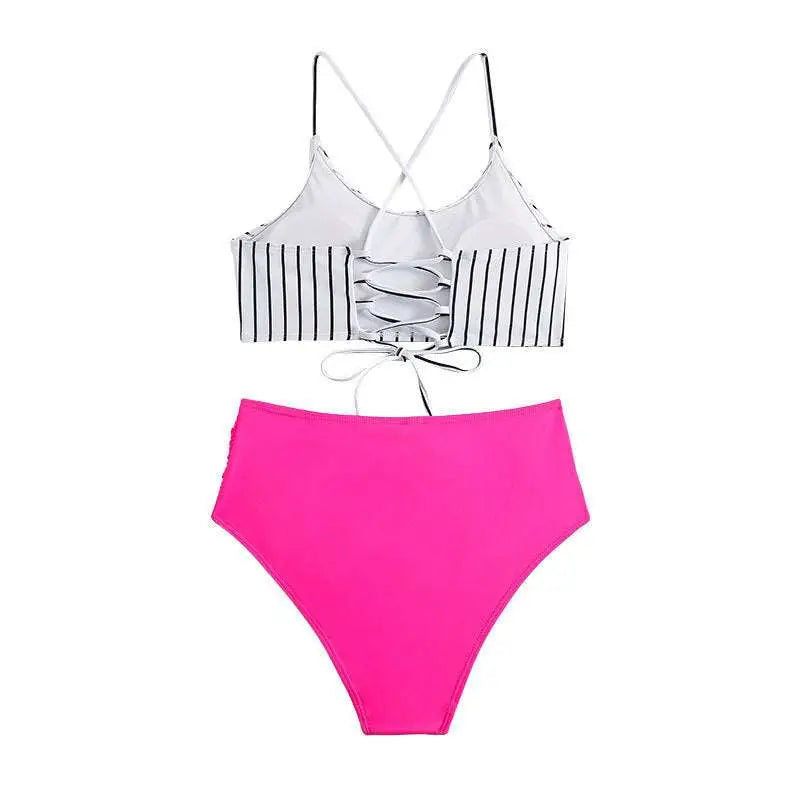 Pink high-waisted bikini bottom paired with white black vertical stripes crossback top with lace-up detailing