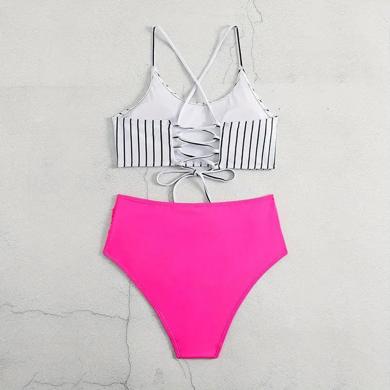 Pink high-waisted bikini bottom with ruched side panels featuring black vertical stripes in a striped bikini split design