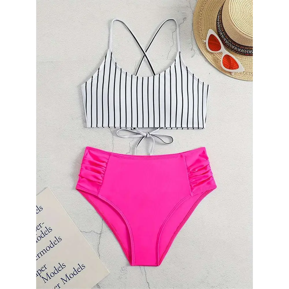 Pink high-waisted bikini bottom with ruched side panels and black vertical stripes in a striped bikini split design