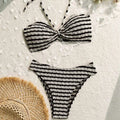 Black and white striped printed swimsuit bikini split set with bow detail made from textured woven knit fabric
