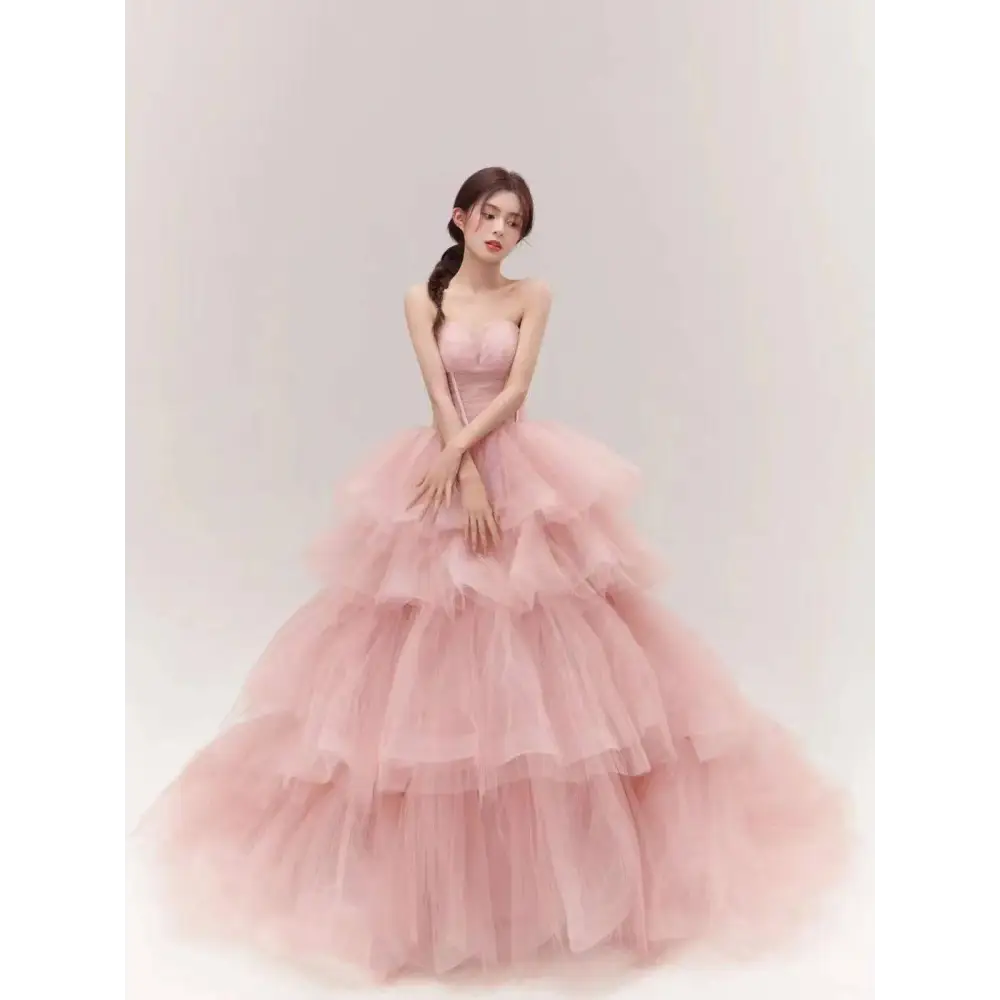 A soft pink tiered tulle dress with a strapless bodice from the fairy temperament main collection