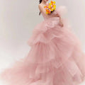 A soft pink tiered tulle dress with a strapless bodice and voluminous ruffled skirt fairy temperament main