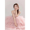 A soft pink tulle wedding photography dress with multi-layered skirt strapless bodice and delicate lace detailing