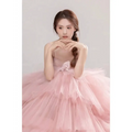 A delicate pink tulle wedding photography dress with a layered sweetheart neckline and voluminous skirt