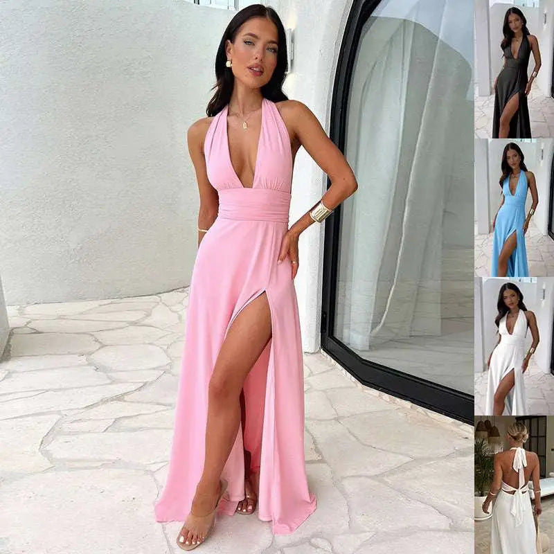 A flowing pink v-neck slit halter-neck maxi dress with a deep v-cut and high slit for summer occasions