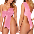 Pink velvet one-piece swimsuit with a large bow front and open back design in luxury women’s fashion lingerie set