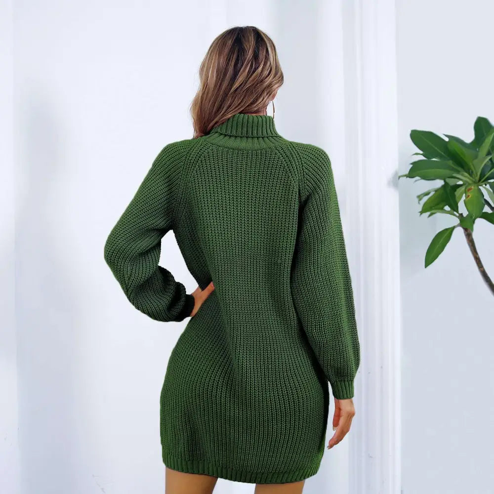 A cozy olive green ribbed knit sweater dress with long sleeves and a high neckline styled without a black belt