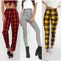 Three pairs of plaid women’s high-waist stretch leggings in red black, black white, and yellow green colors