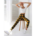 Yellow and black plaid women’s high-waist stretch leggings with a front zipper detail for stylish comfort