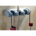 Gray plastic mop hook wall hanging organizer rack with three hooks holding different types of umbrellas
