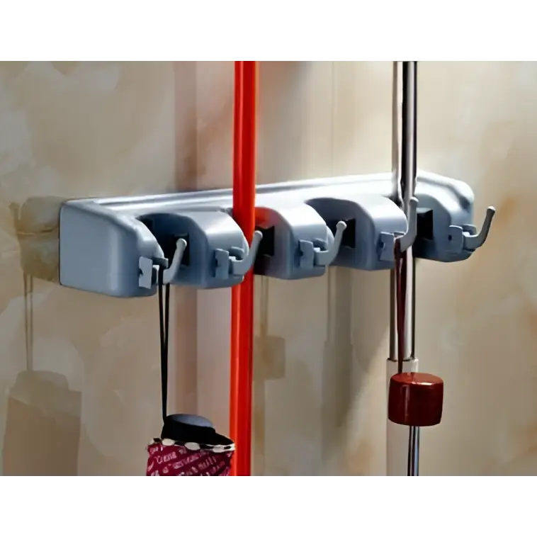 Gray plastic mop hook wall hanging organizer rack with four hooks holding a red-handled brush and silver rod