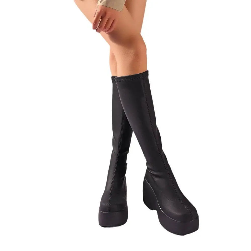 Black platform knee high elastic leather boots with sleek stretchy material and bold block heels for stylish wear