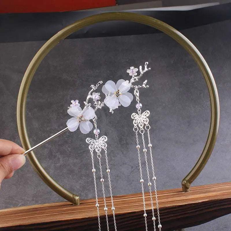 Silver plum blossom ancient style hairpin with delicate white floral embellishments and butterfly chain accents for hanfu hair accessories