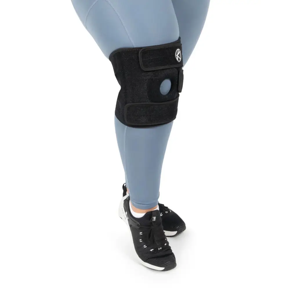 Plus size adjustable black knee brace xl 3xl with circular hinge and velcro straps for support and stability