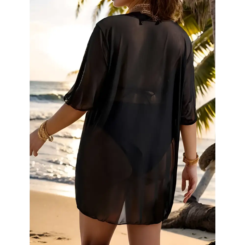 Plus size blouse bikini swimsuit cover up in black sheer mesh with three-quarter sleeves and loose flowing design