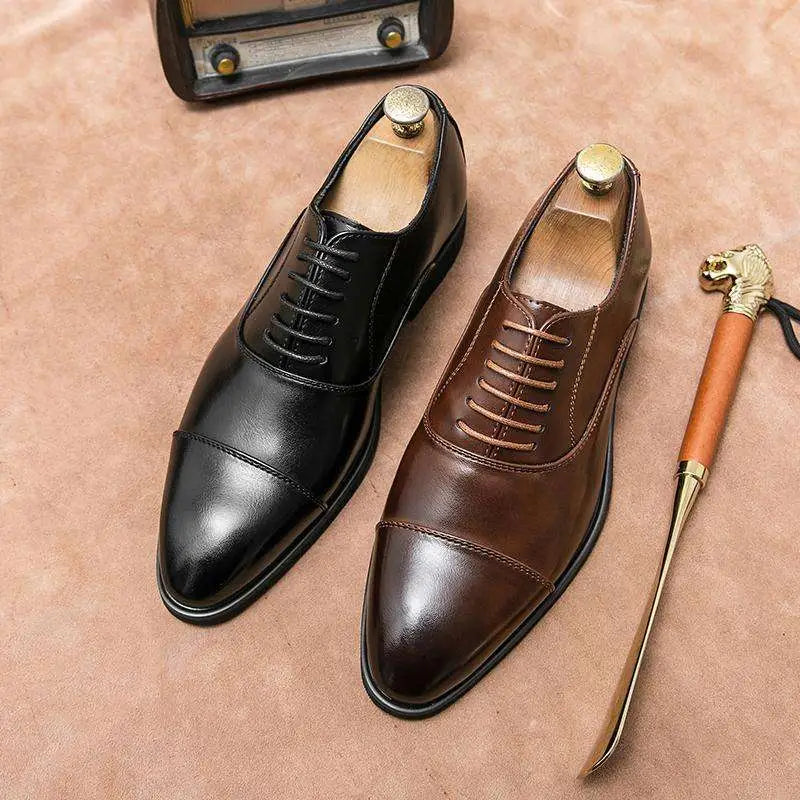 A pair of plus size casual leather shoes with brown and black cap toe oxford design and matching laces