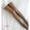 A pair of plus size fake translucent fleece lined tights in nude with sheer, smooth, and slightly glossy finish