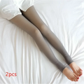 A pair of plus size fake translucent fleece lined tights in dark gray with sheer, smooth, stretchy material and snug fit