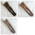Plus size fake translucent fleece lined tights in black beige and nude displayed on a white bedspread