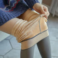Beige plus size fake translucent fleece lined tights with plush lining, stretchy seamless design, and subtle gray trim