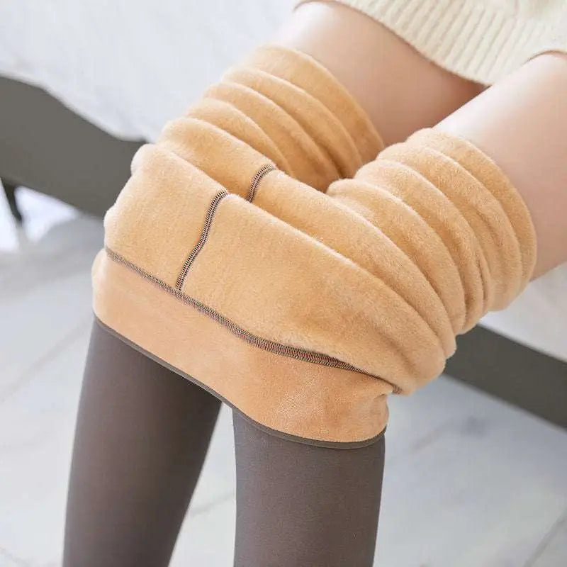 Plus size tan plush fabric fleece lined tights with ribbed texture and dark brown stitching along the seams