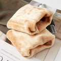 A pair of beige plus size fake translucent fleece lined tights folded neatly showing plush fleece material