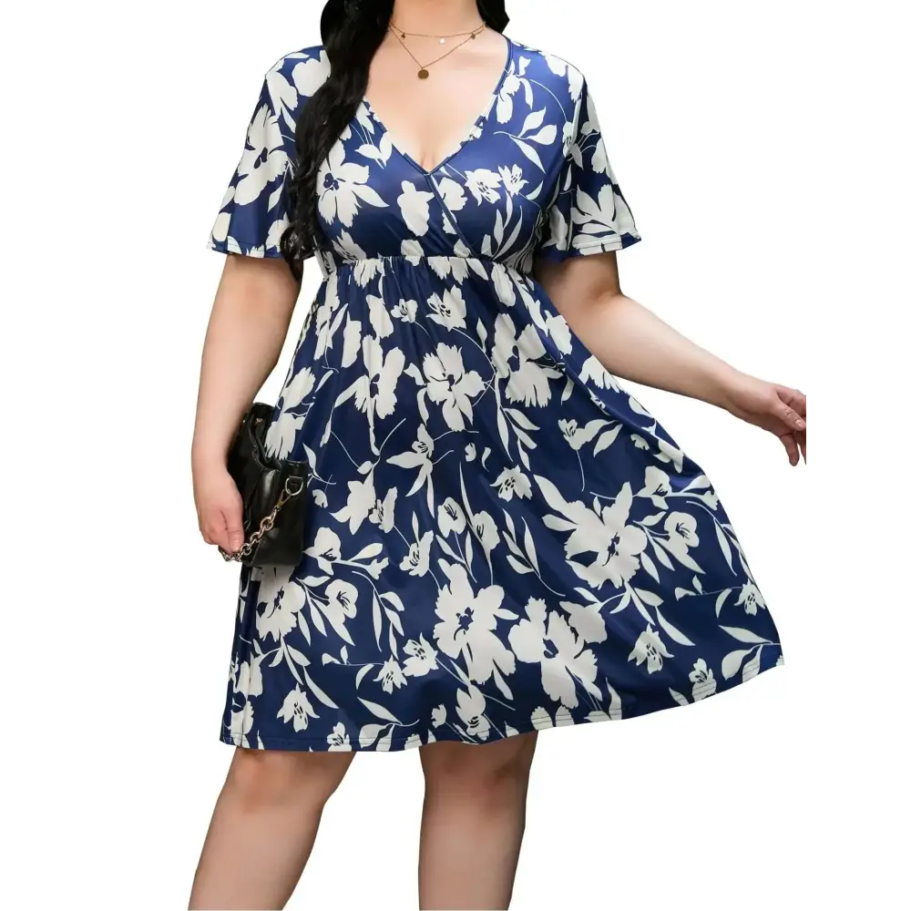 Plus size floral v neck flutter sleeve dress in navy blue and white with short flutter sleeves and floral print
