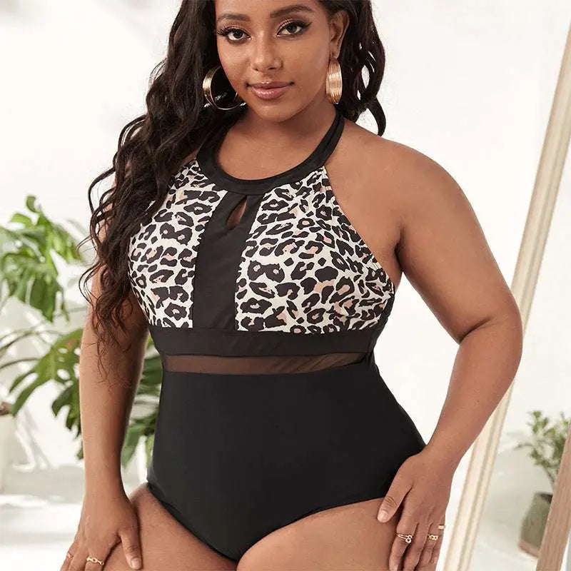 Plus size leopard print mesh one piece swimsuit with black and white halter design and sheer mesh panel at the waist