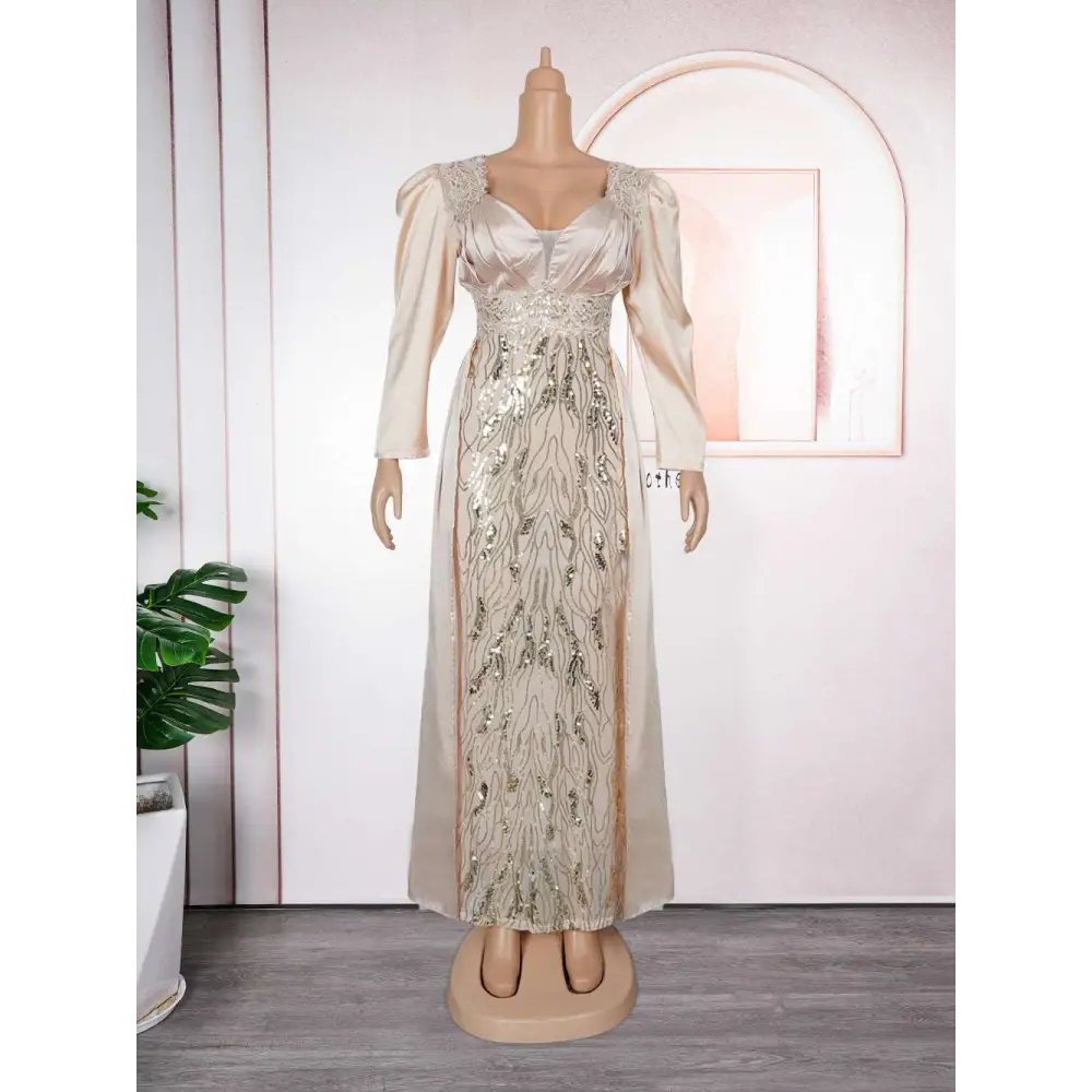 Elegant plus size long sleeve sequined evening dress in champagne satin with intricate silver beading and puffed sleeves