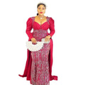 White lace clutch with scalloped edges and handle accompanying a vibrant red plus size long sleeved sequined evening dress