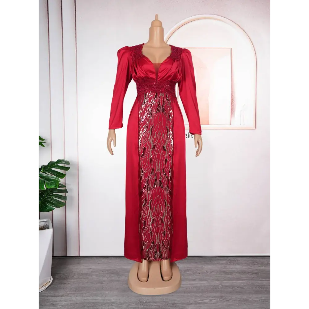 Plus size long sleeve sequined evening dress in vibrant red satin with gold and black feather-like sequined panel