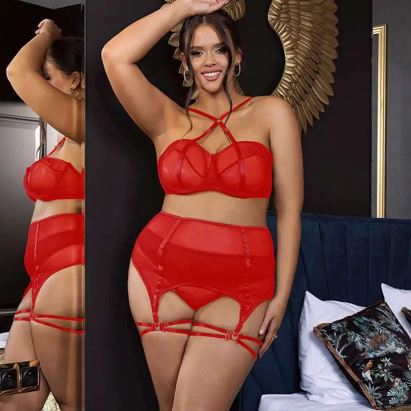 Plus size mesh lingerie set in red sheer lace with a strappy bra and matching garter belts for elegant wear