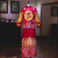 Plus size red slimming toast dress featuring vibrant red dragon embroidery and colorful patterned hem for weddings