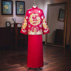 A plus size red dragon embroidery slimming toast dress with intricate gold and white dragon and cloud motifs on mannequin