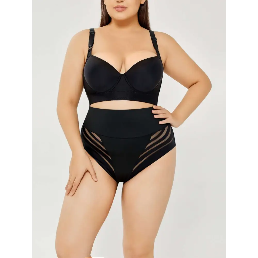 Plus size shaping black high-waisted bikini set with sheer mesh panels on sides for flattering shaping mesh bikini look