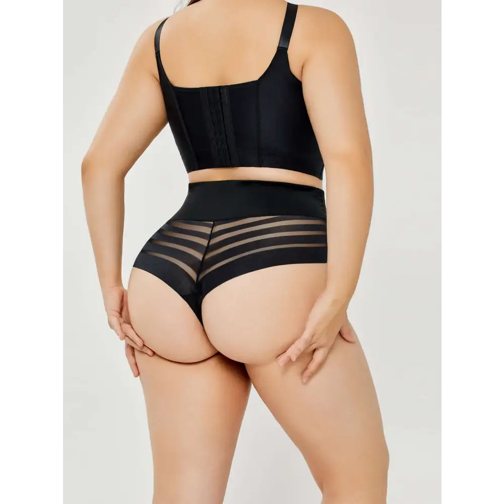 Black high-waisted plus size shaping mesh bikini briefs with sheer panels and structured form-fitting design