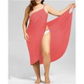 A flowing coral plus size suspenders beach skirt cover up with thin straps and a high slit for shoulder cover