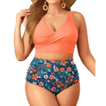 Plus size tummy control floral bathing suit with coral cross-front tank top and navy blue orange peach floral shorts