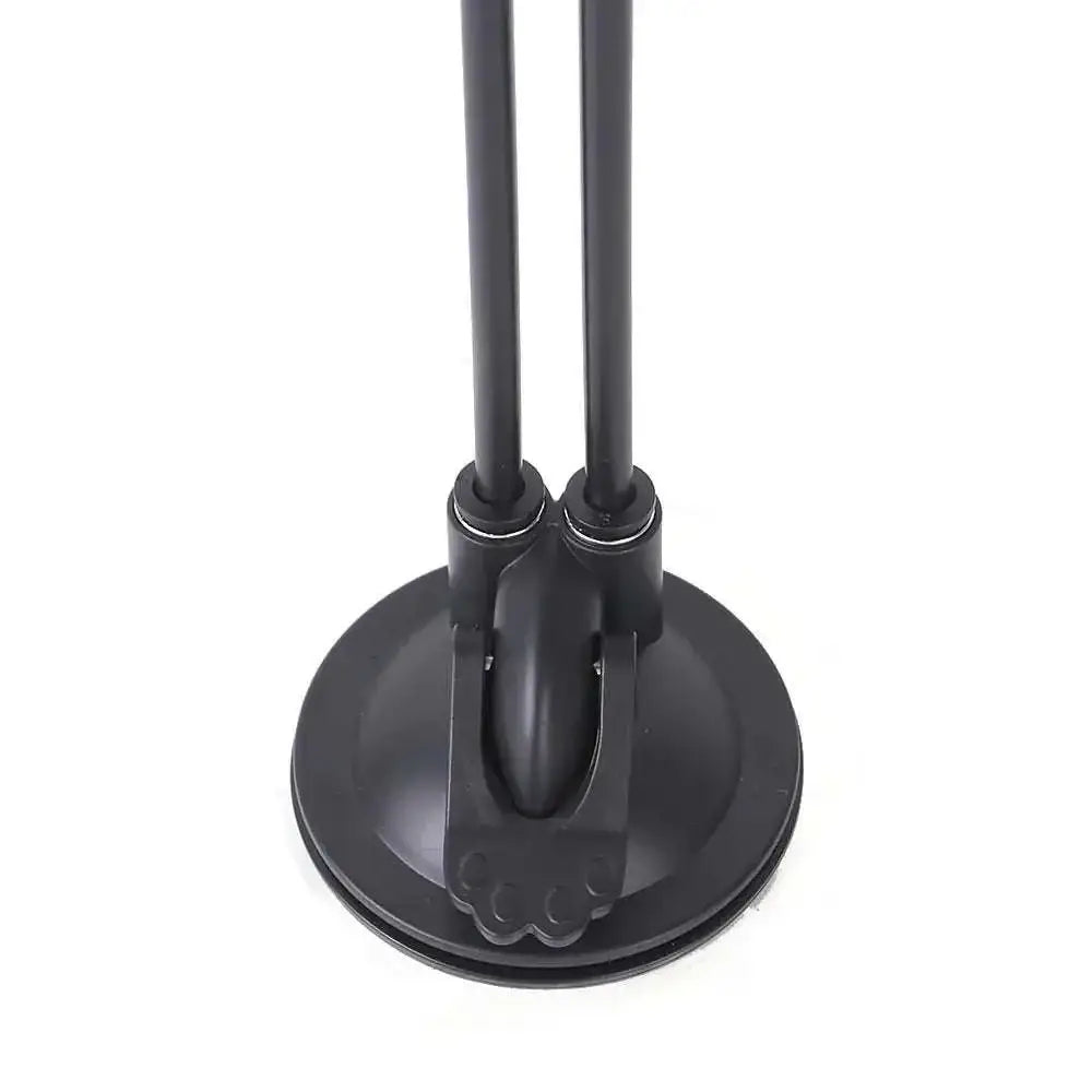 Black dual-armed desk lamp with circular suction base featured alongside plush flower cat sucker teaser toy with feathers