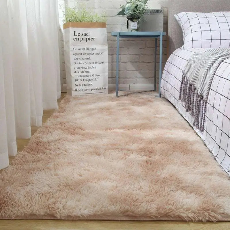 A plush gray shaggy carpet floor mat with soft fluffy texture and beige tones lies on the floor