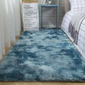 Plush gray shaggy carpet floor mat with a soft fluffy texture and blue gradient color transitions from light to dark blue