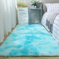 Plush gray shaggy carpet floor mat with a soft, fluffy texture and gradient blue and white design