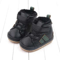 Black textured leather baby shoes with green accents plush lined sports soft sole and velcro straps