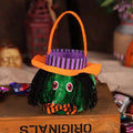 Plush pumpkin halloween candy bags feature a green witch design with an orange hat black yarn hair and red eyes for party favour bags
