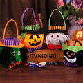 Orange plush pumpkin halloween candy bag with green striped witch hat and purple handle for party favour bags