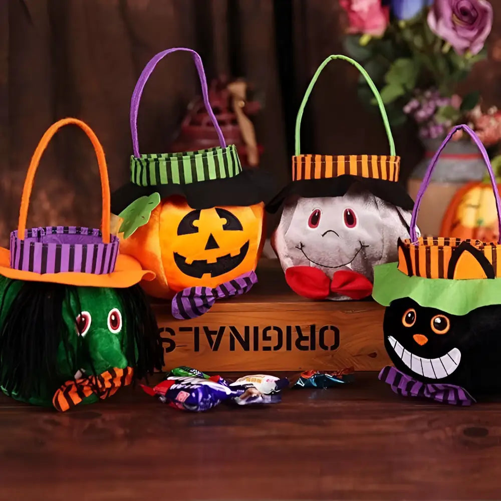 Orange plush pumpkin halloween candy bag with green striped witch hat and purple handle for party favour bags