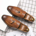 Brown pointed men’s slip woven leather shoes with tassels and gold-toned metal accents for formal wear