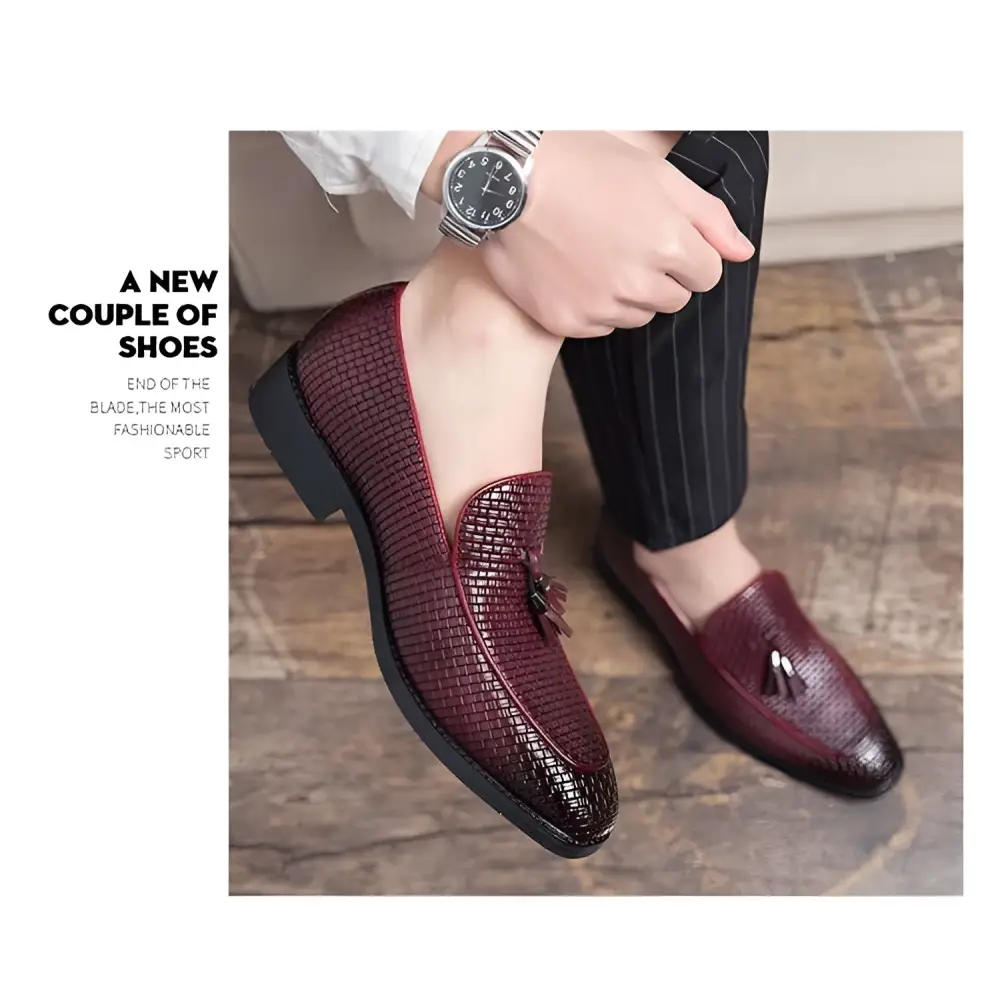 Pointed men’s slip on burgundy woven leather shoes with tassels featuring a rich textured design