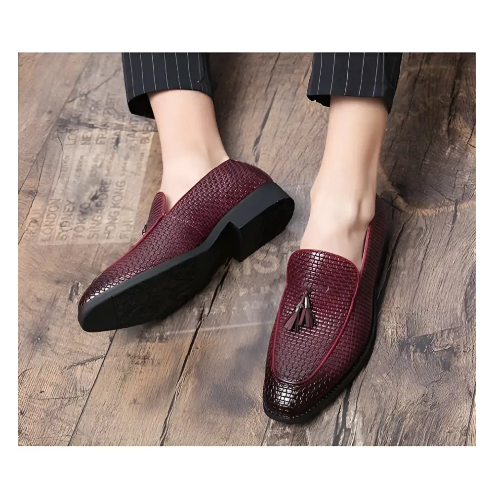 Pointed men’s slip burgundy woven leather shoes with black rubber soles and tassel detail slip woven leather loafers