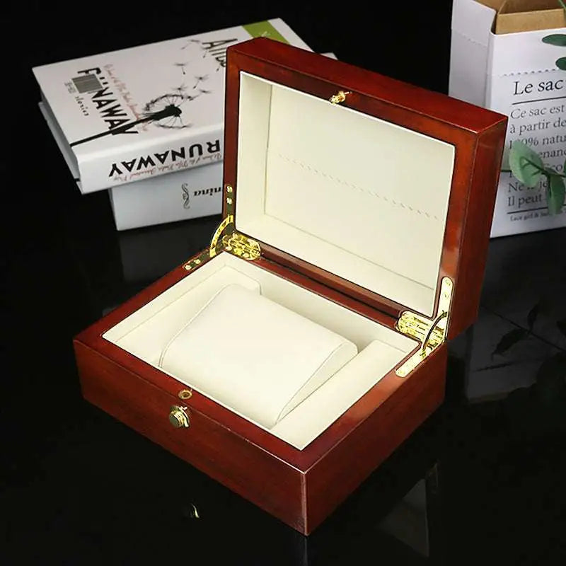 Polished reddish brown watch box custom with rich mahogany wood, gold-tone hardware, and cream velvet interior for jewelry